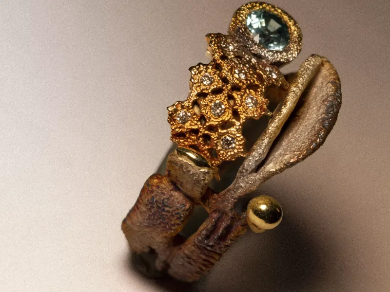Anello artigianale in argento ossidato con parti traforate in bronzo, zircone naturale azzurro, gocce d'oro e diamanti