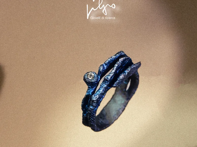 anello artigianale in titanio blu acceso o grigio con diamante
